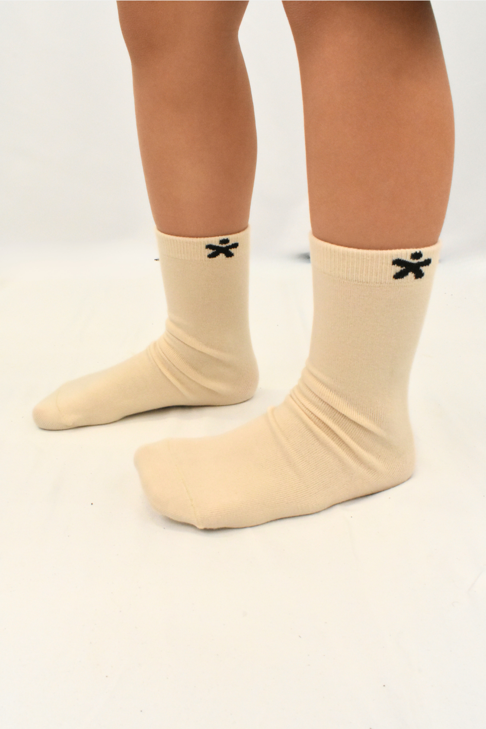 pair of tagless, rubber-free soft socks for sensory-sensitive feet.