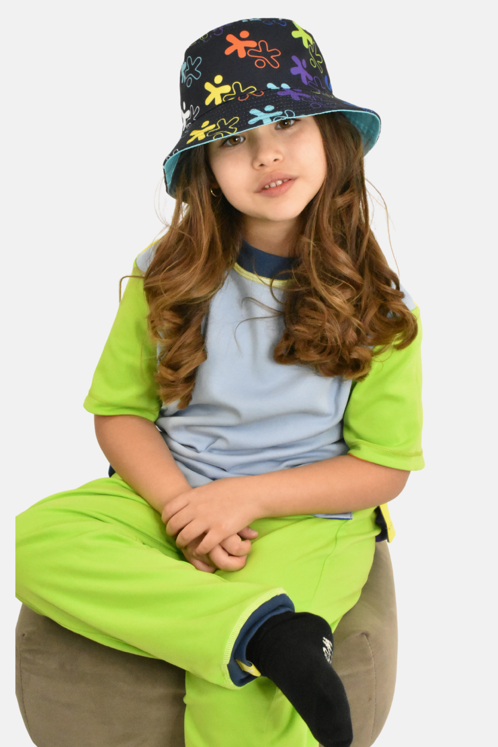 kid wearing reversible tagless colorful tee made from organic cotton