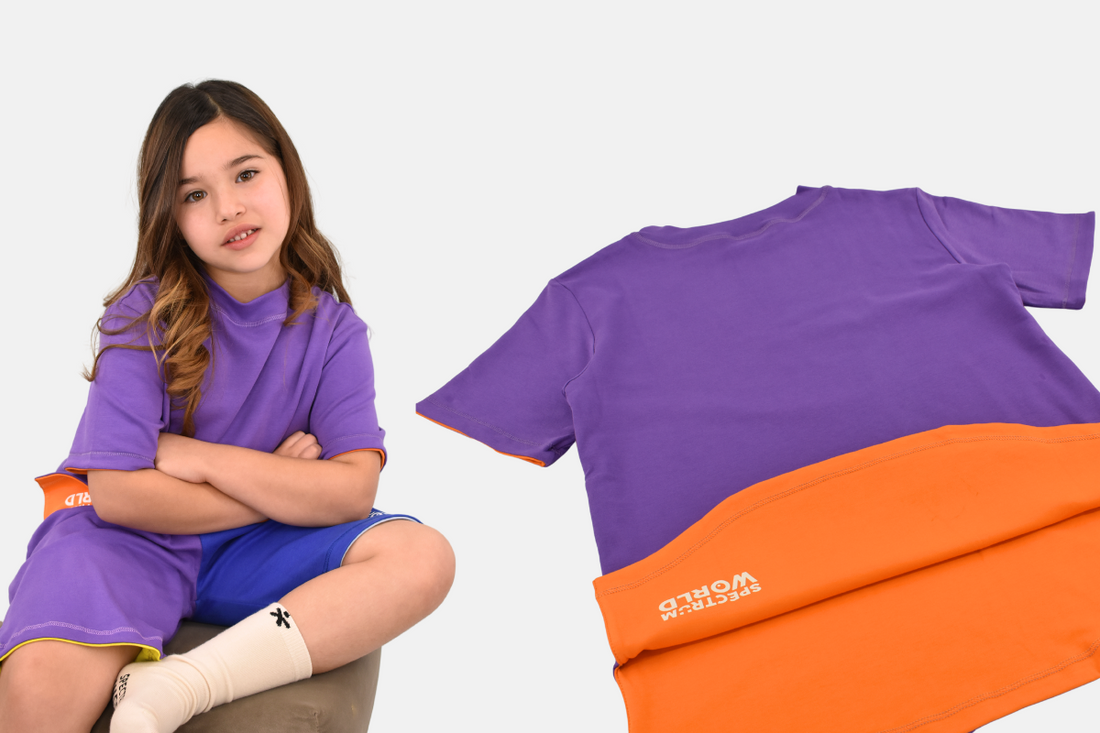 close-up of tagless shirt being worn by a smiling autistic child