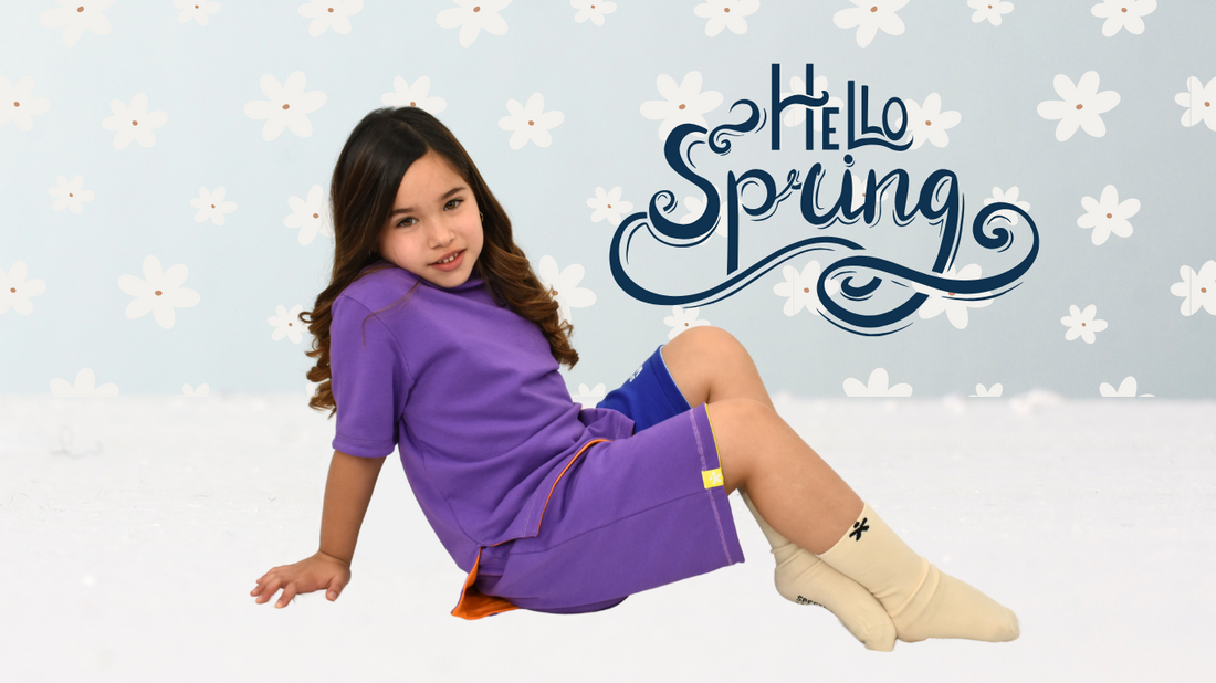child with sensory needs dressing independently in tagless adaptive clothing from Spectrum World